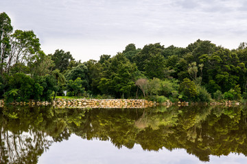 Fototapeta na wymiar Dramatic mountain reflections on a very calm lake