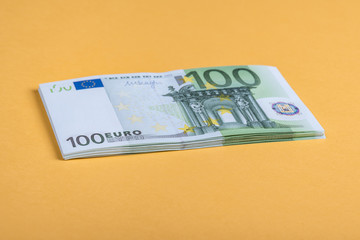 Euro cash on a yellow and pink background. Euro Money Banknotes. Euro Money. Euro bill. Place for text.