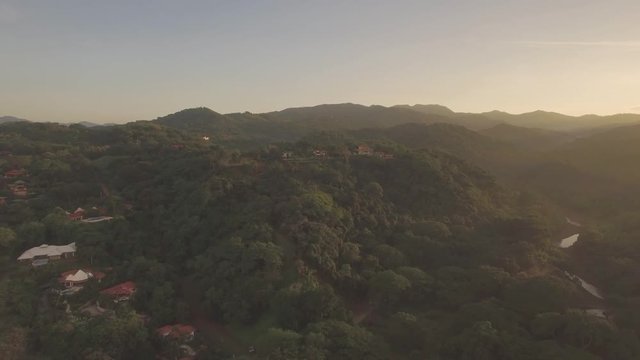 Good real estate video for flying over the tropical jungle during sunrise...  use before a close up of the house.  This was taken in Samara Beach, Costa Rica at 545 in the morning