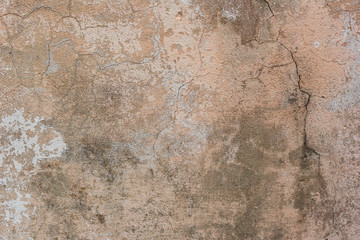 Texture of a concrete wall with cracks and scratches which can be used as a background