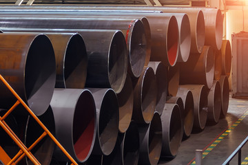 Black steel pipes in warehouse