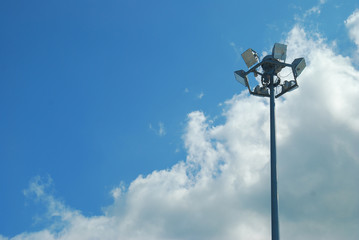 The spotlights and the clouds in the sunny sky