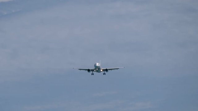 The airplane landing at the airport, Front view