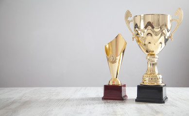  Golden trophy on white desk. Business, Success - obrazy, fototapety, plakaty