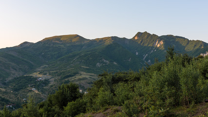 Mountain range covered with green forest in the morning