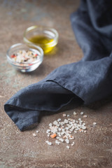 Seasonings for cooking. Sea salt and olive oil on a table