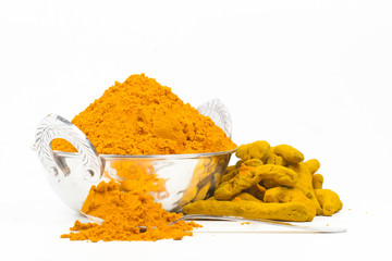 Turmeric powder isolated on a white background