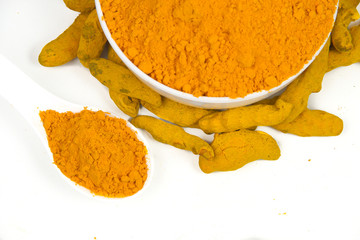 Turmeric powder isolated on a white background