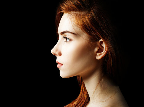 Beauty portrait of redhead woman.