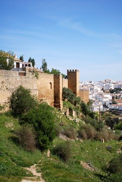 View along the old town wall towards the town, Ronda, Spain.