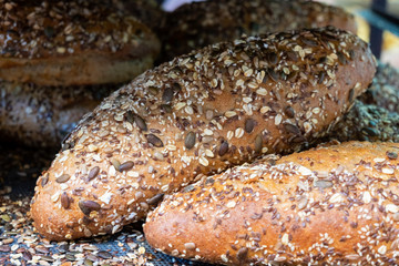 Fresh brown bread with sesame and sunflower seeds  for sale at local farmers market