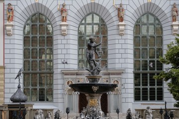 Poland, Gdansk, Old City - famous statue of Neptune fountain and Artus Court in background