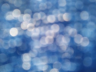 white glitter on dark blue denim background