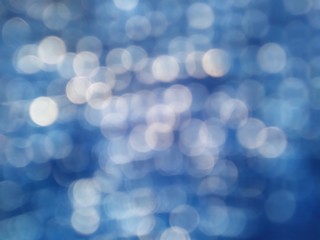 white glitter on dark blue denim background