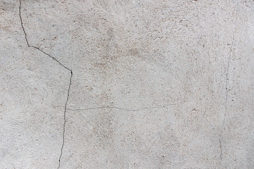 Dark plaster wall with dirty cracked scratched background. Old retro vintage brickwall with peel grey stucco texture