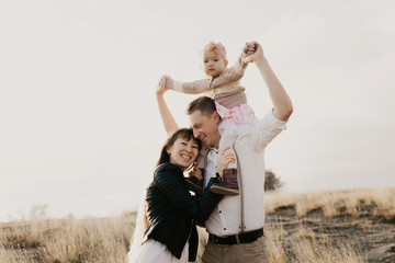 Young family with children having fun outdoor