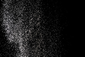 Flour sifting on a black background. White powder splash isolated on black background. Explosive powder white