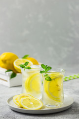 Iced lemon mint tea with ginger and honey. Selective focus, space for text.
