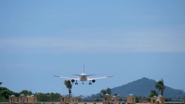 The Airplane landing at Samui Airport, Thailand. looking from behind