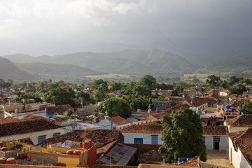 Fototapeta na wymiar Trinidad, Cuba - July 20, 2018: The roofs of the historic center of Trinidad viewed from the tower of Convento San Francis of Assisi in Cuba