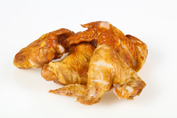 Smoked chicken wings over white background