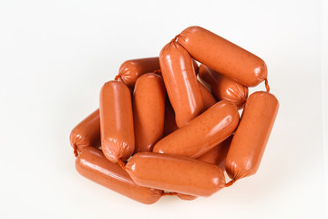 Tasty meat sausages over white background