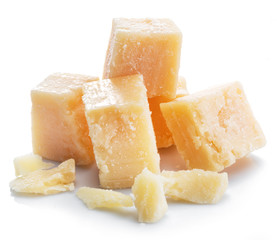 Parmesan cheese cubes isolated on white background.