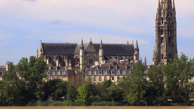 Basilica of Saint-Michel and its spire in Bordeaux and 18th century style buildings along the banks of the river Garonne, UNESCO World Heritage site