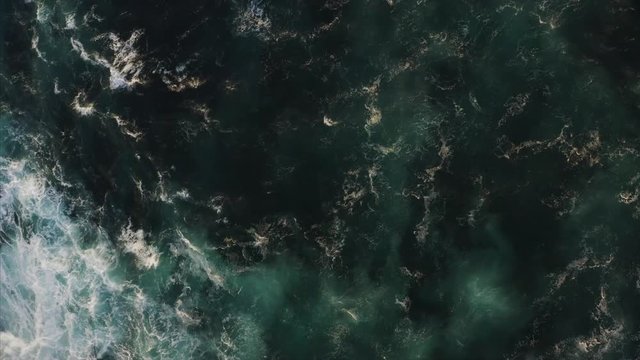 Aerial top view of ocean waves of beautiful dark azure color. Bali, Indonesia