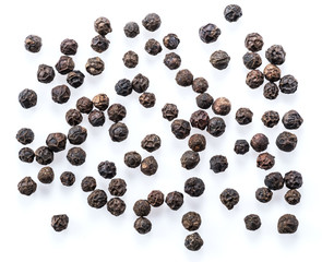 Black peppercorns isolated on white background.