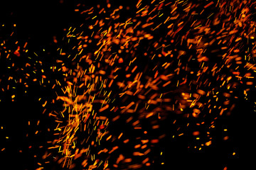 flame of fire with sparks on a black background