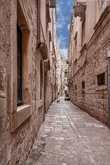 Fototapeta na wymiar narrow cobblestone street in the old part of the Croatian city of Dubrovnik