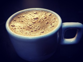 cup of coffee on black background