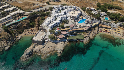 Aerial drone photo of small peninsula with picturesque chapel and beach of Agia Anna as well as...
