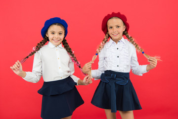 Together since school. happy children in uniform. International exchange school program. friendship and sisterhood. best friends. little girls in french beret. Education abroad. kid fashion