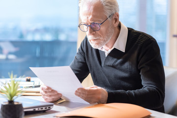 Senior businessman reading a document