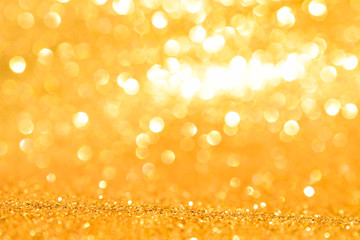 shine and sparkle of golden glitter abstract background	