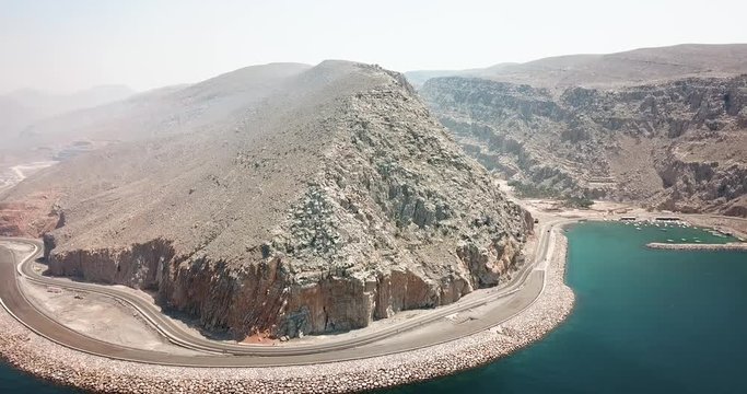 Coastal road and seaside in Musandam Governorate of Oman aerial footage