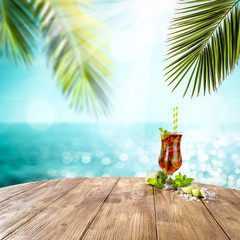 Summer drink on desk and beach landscape 