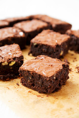 Homemade chocolate brownies on a baking sheet, side view. Close-up.