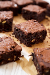 Homemade chocolate brownies on a baking sheet, side view. Close-up.