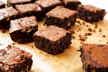 Homemade chocolate brownies on a baking sheet, side view. Closeup.
