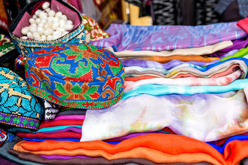 Fototapeta na wymiar Silk scarves from Uzbekistan on the market.