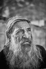Close-up shot of an old homeless man's face
