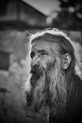 Close-up shot of an old homeless man's face