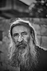 Close-up shot of an old homeless man's face