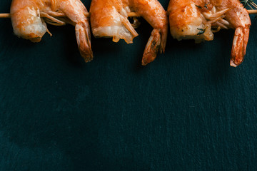 Copy space photo with prawns on the wooden stick