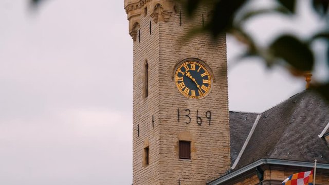 Slow camera pan of a bell tower in the city of Lier, Belgium.