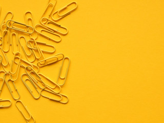 Yellow paperclips on yellow