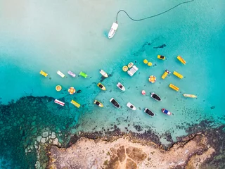 Fotobehang Island with boats parked near fig tree bay beach © frimufilms